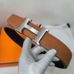 Hermes leather belt with silver-tone buckle and tan-brown strap, side profile