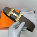 Hermes belt dark brown leather with large gold H buckle, angled view