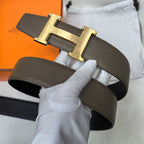 Hermes belt dark brown leather with gold H buckle and visible strap holes