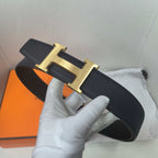 Hermes belt angle view: textured dark leather strap with gold-tone H buckle