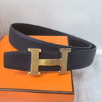 Hermes belt front view: dark leather strap with large gold-tone H buckle