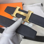 Hermes belt buckle view: dark leather strap with gold-tone H and stitched holes