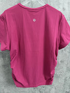 Pink ribbed T-shirt back with small circular logo and crew neck