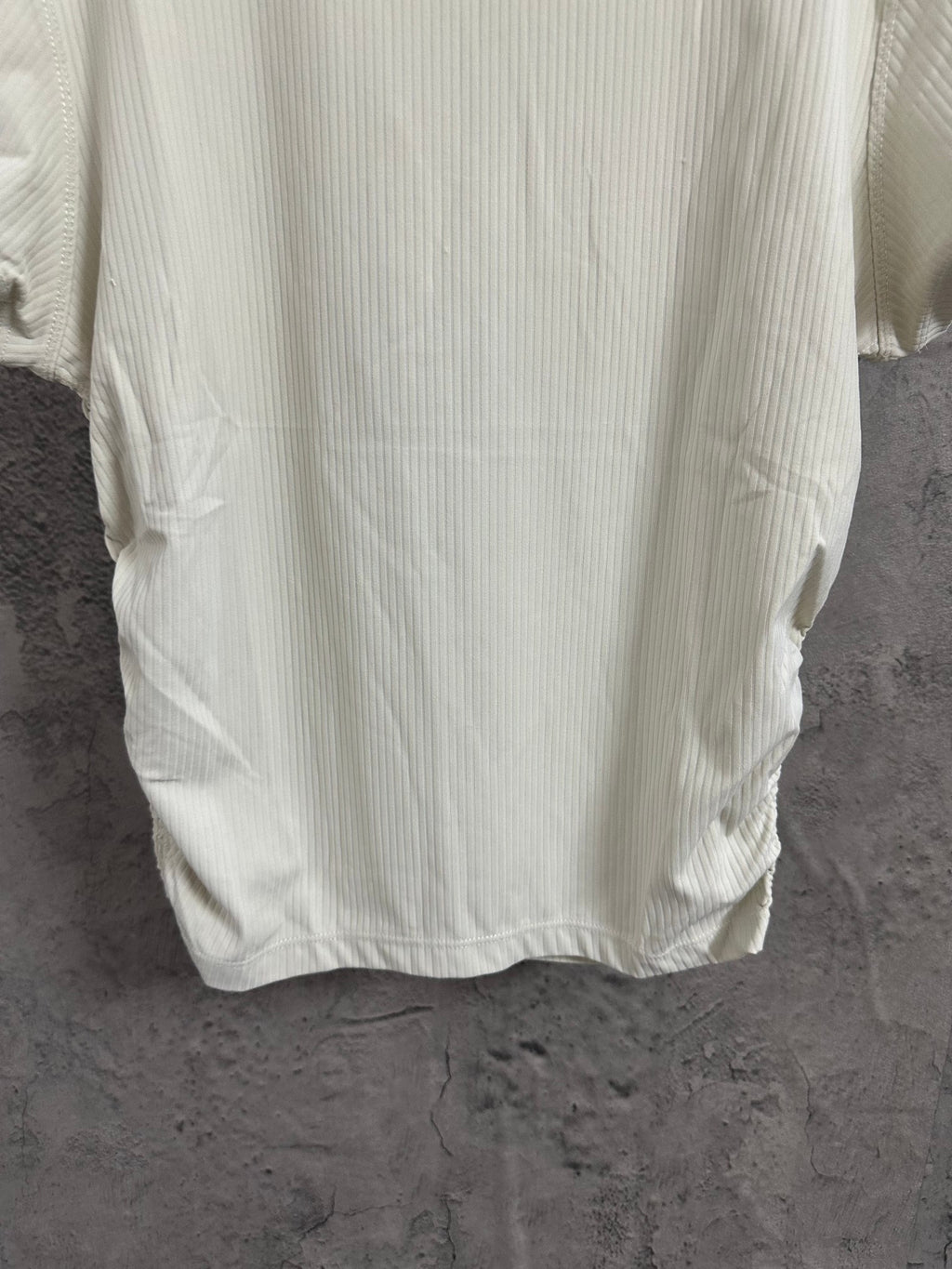 Cream ribbed T-shirt back hem and lower back detail