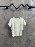 Off-white crew-neck T-shirt with short sleeves and ribbed texture