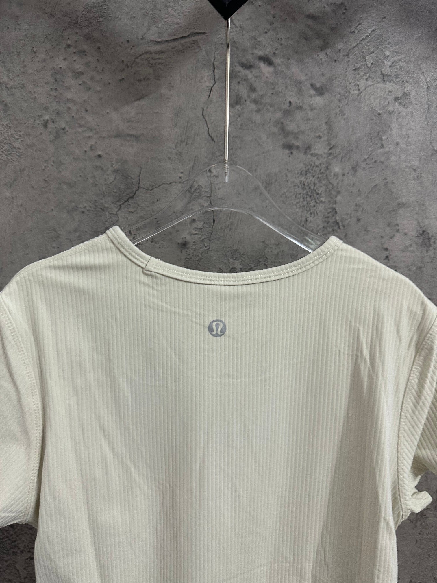 Cream ribbed T-shirt with small chest logo on front