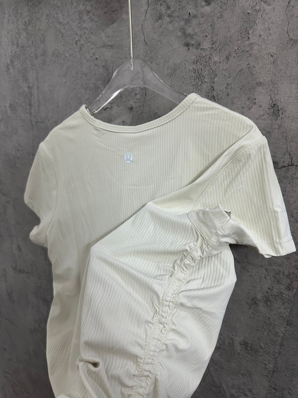 Cream ribbed T-shirt with small chest logo and folded detail