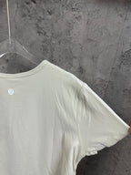 Off-white ribbed T-shirt sleeve and shoulder seam close-up