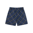 Navy plaid shorts with drawstring waist, side pockets, and relaxed fit