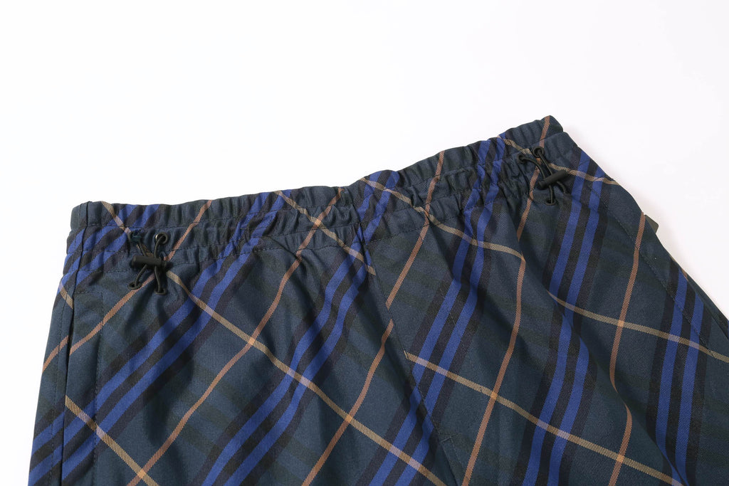 Plaid shorts waistband with elastic, drawstring ties, and gathered trim