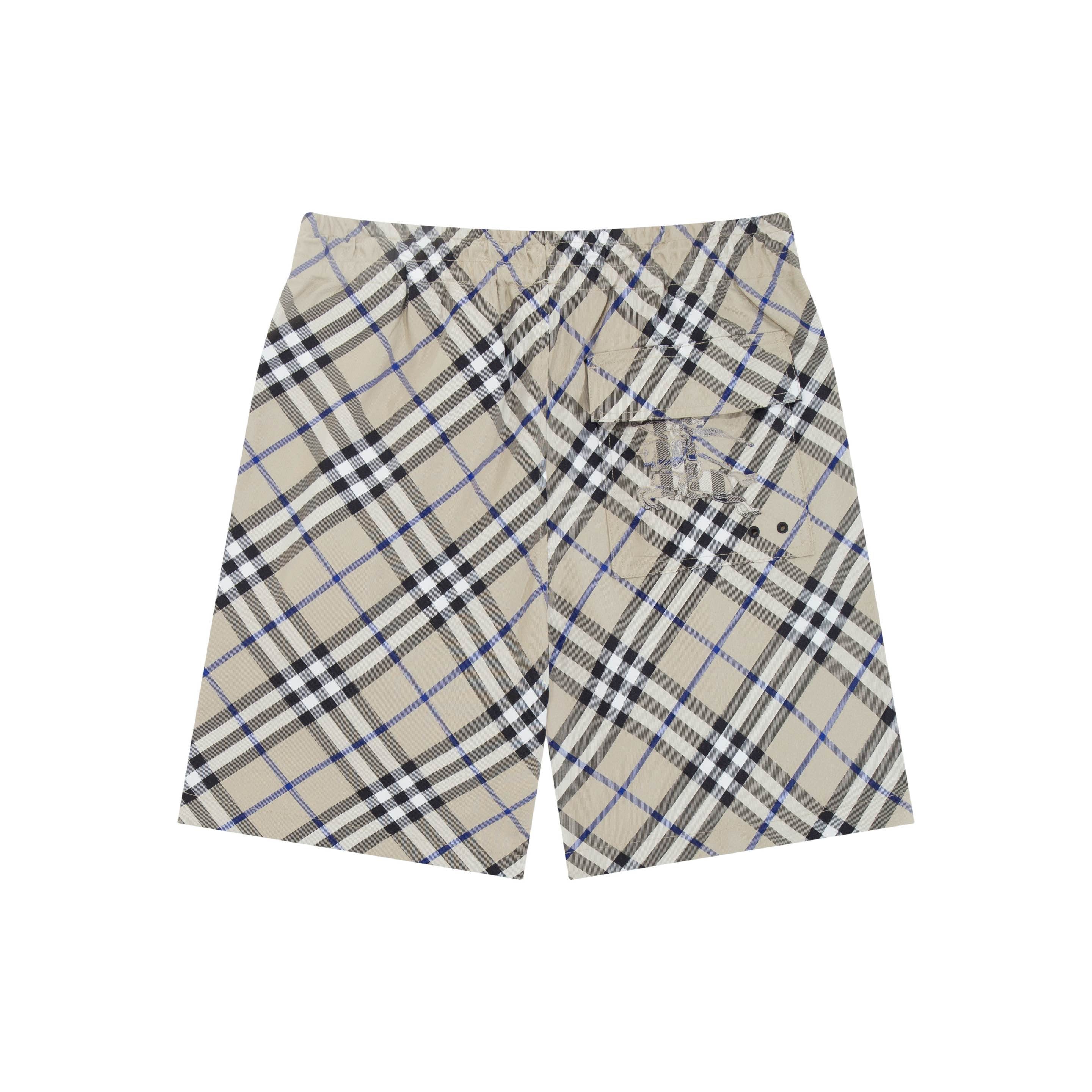 Burberry check plaid shorts, beige with black and blue; side pockets and button details