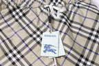 Burberry check plaid shorts fabric with brand tag hanging from the waistband