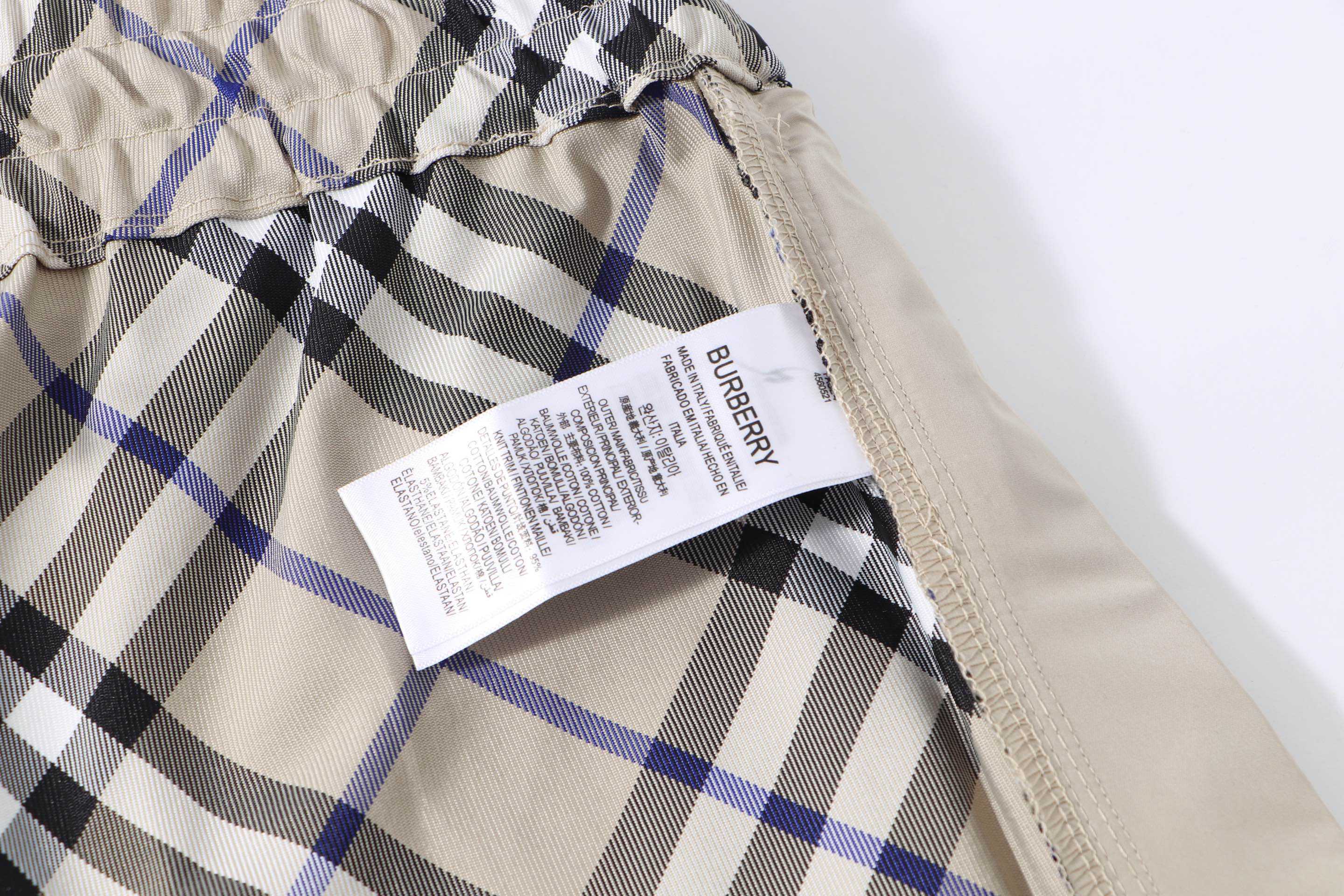 Burberry check plaid shorts with size and care labels inside the waistband