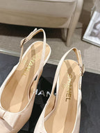 Women's beige slingback heels showing interior lining and 'CHANEL' insole