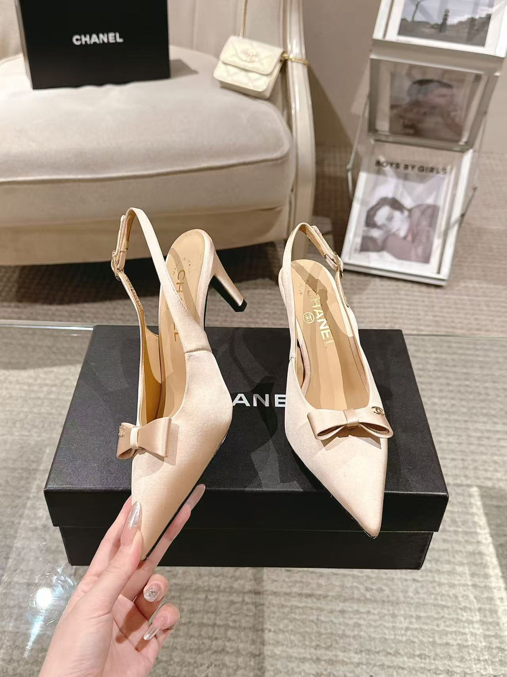 Women's beige pointed-toe slingback heels with bow, sling strap, and block heel