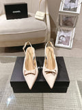 Women's pointed-toe slingback heels in beige with bow detail and block heel
