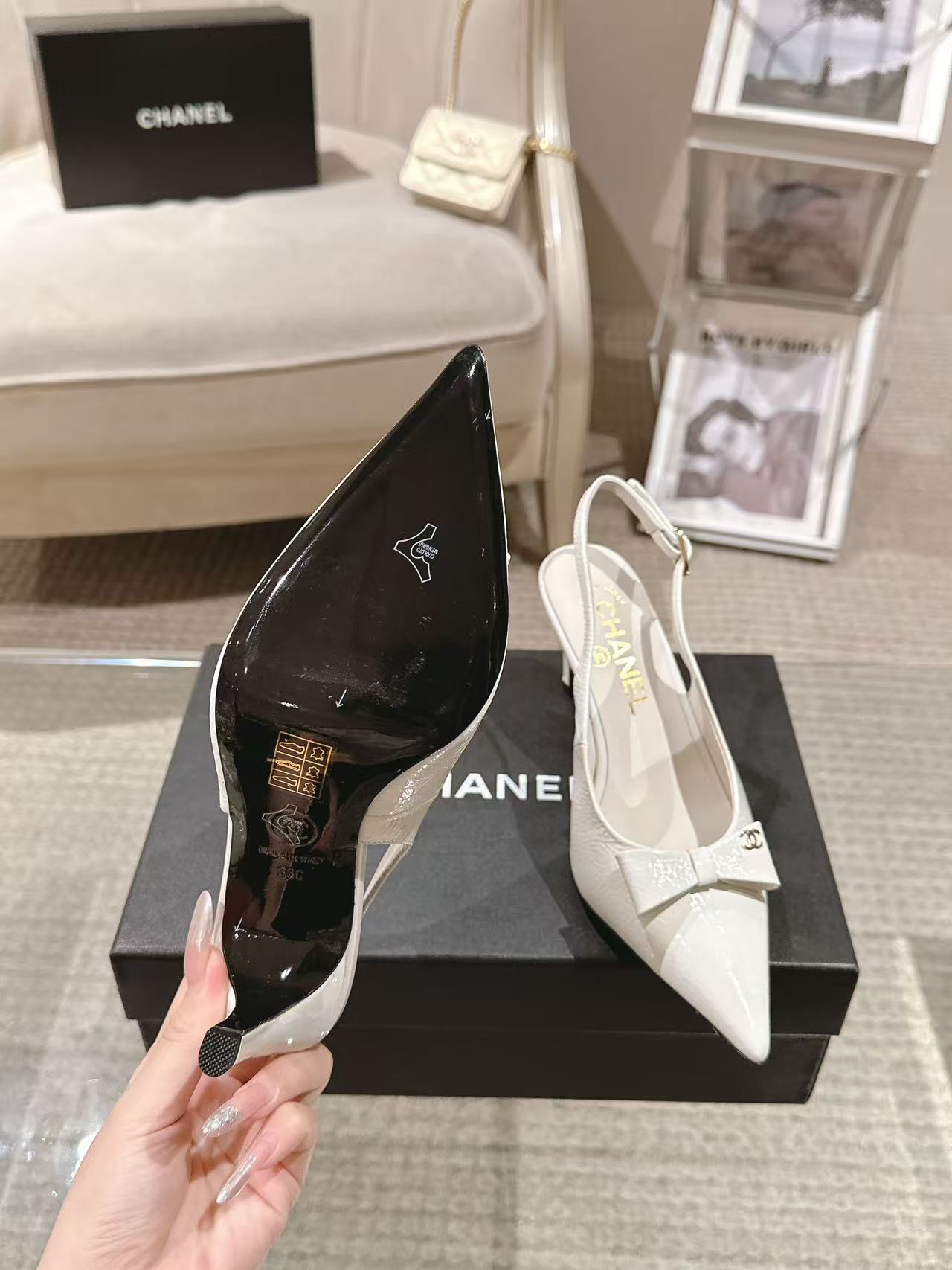Black pointed-toe slingback pump and white pointed-toe slingback pump with bow