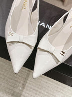 White textured leather slingback pumps with bow strap and Chanel logo
