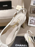 White slingback pump with printed insole and slim black heel