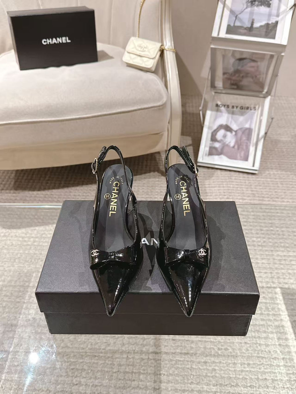 Chanel black patent pointed-toe pumps with slingback strap and bow detail