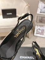 Chanel black patent slingback pumps close-up, logo on insole and strap