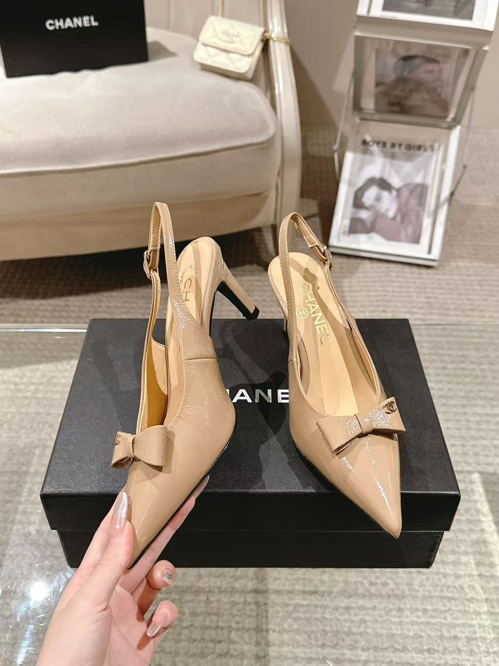 Women’s beige pointed-toe slingback pumps with bow detail and glossy upper