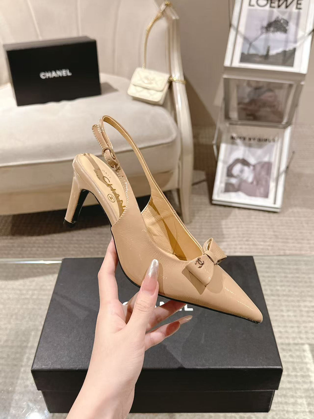 Women’s beige patent slingback pumps with bow detail and slim stiletto heel