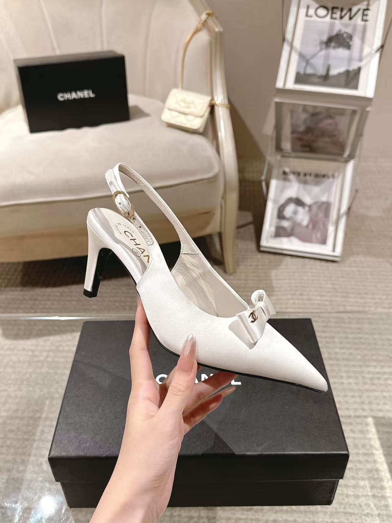 Chanel ladies white pointed-toe slingback pump with bow on heel strap