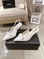 Chanel ladies white pointed-toe slingback pumps with bow detail on box