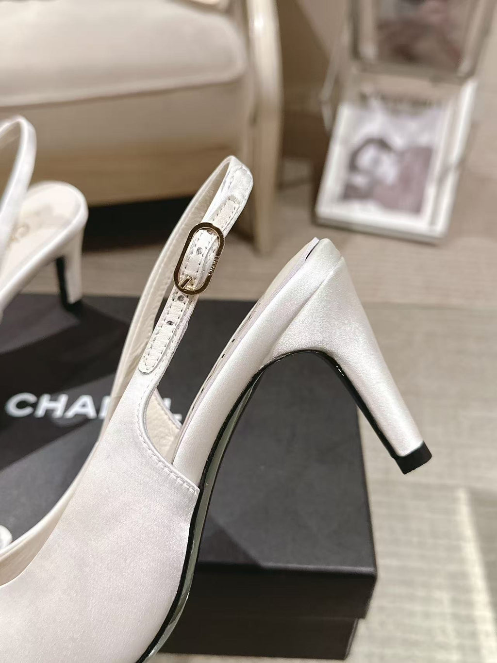 Chanel ladies white slingback pump side view with pointed toe and heel