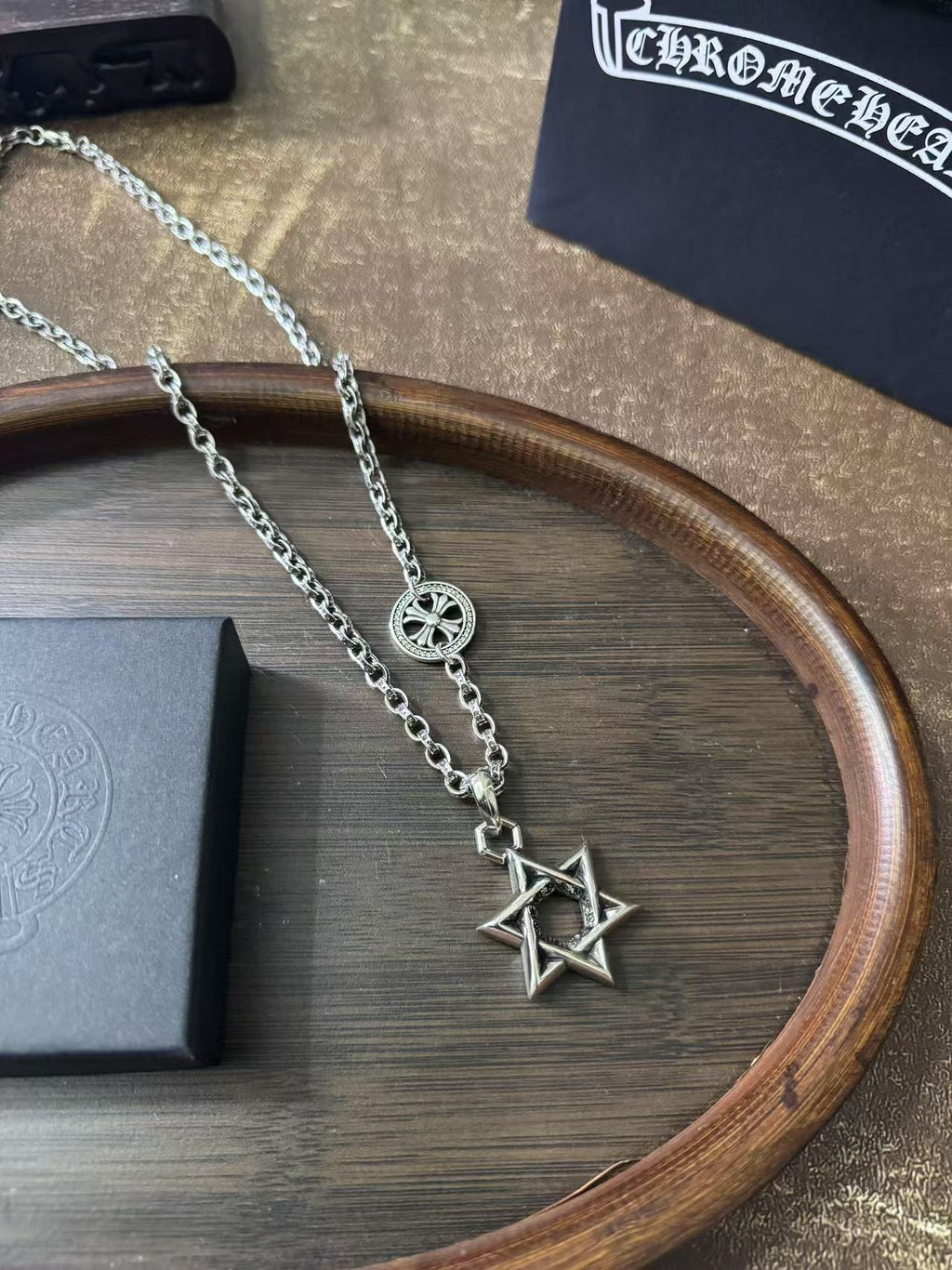 Silver-tone pendant necklace with star of David charm and chain links