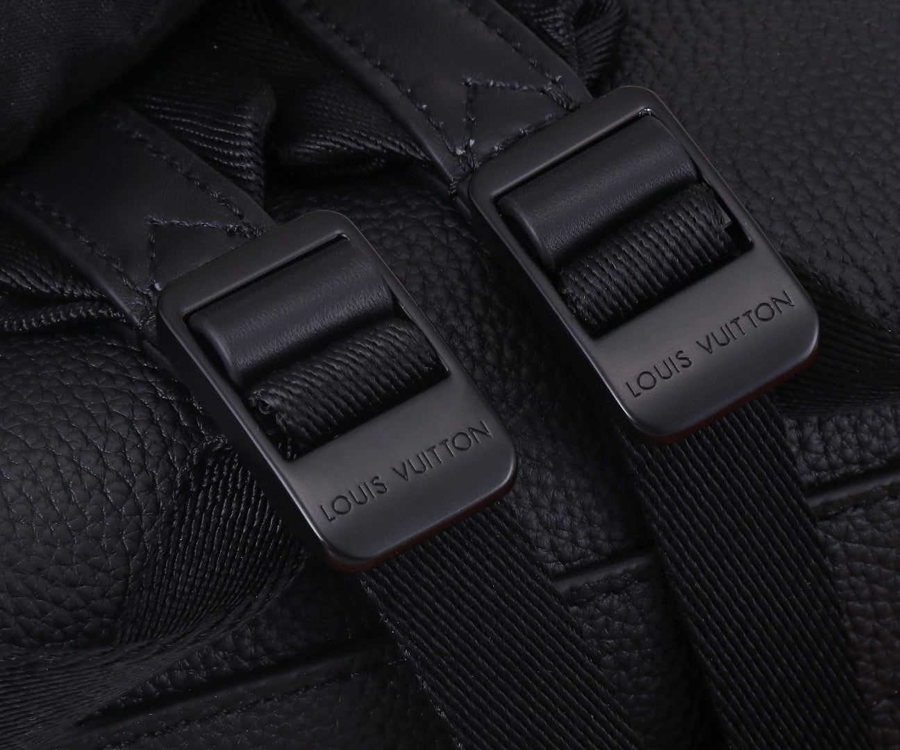 Black leather strap ends with engraved buckle hardware