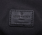 Louis Vuitton Paris leather label reading “made in France” on black fabric.