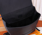 Open Louis Vuitton leather bag showing interior lining and logo patch.