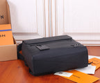 Men’s Louis Vuitton leather duffel-style bag with top handle, black.
