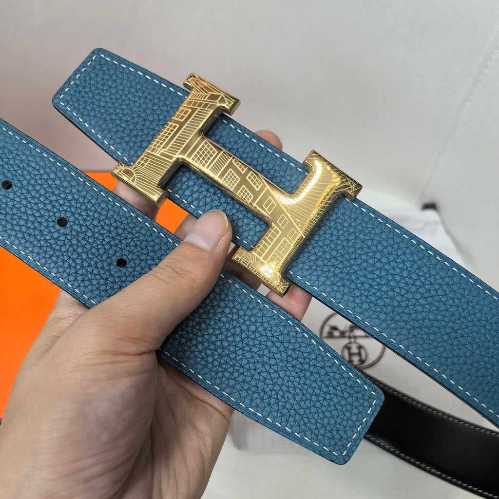 Hermes blue leather belt with gold-tone H buckle and adjustment holes