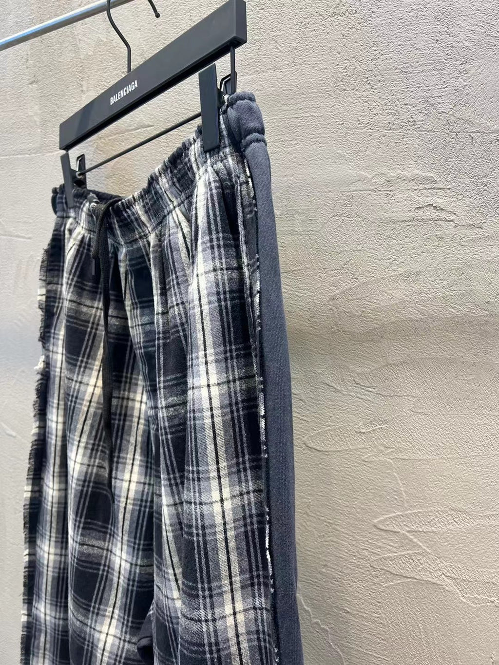 Plaid wide-leg pants with gathered elastic waist and vertical side seam detail