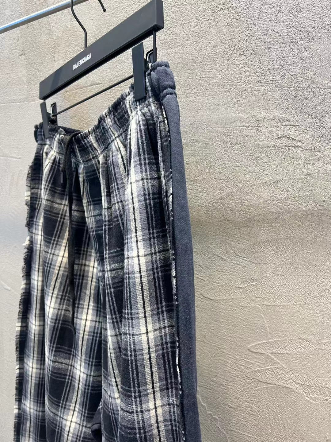 Plaid wide-leg pants with gathered elastic waist and vertical side seam detail