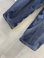 Navy wide-leg pants laid flat with elastic waistband and straight hems
