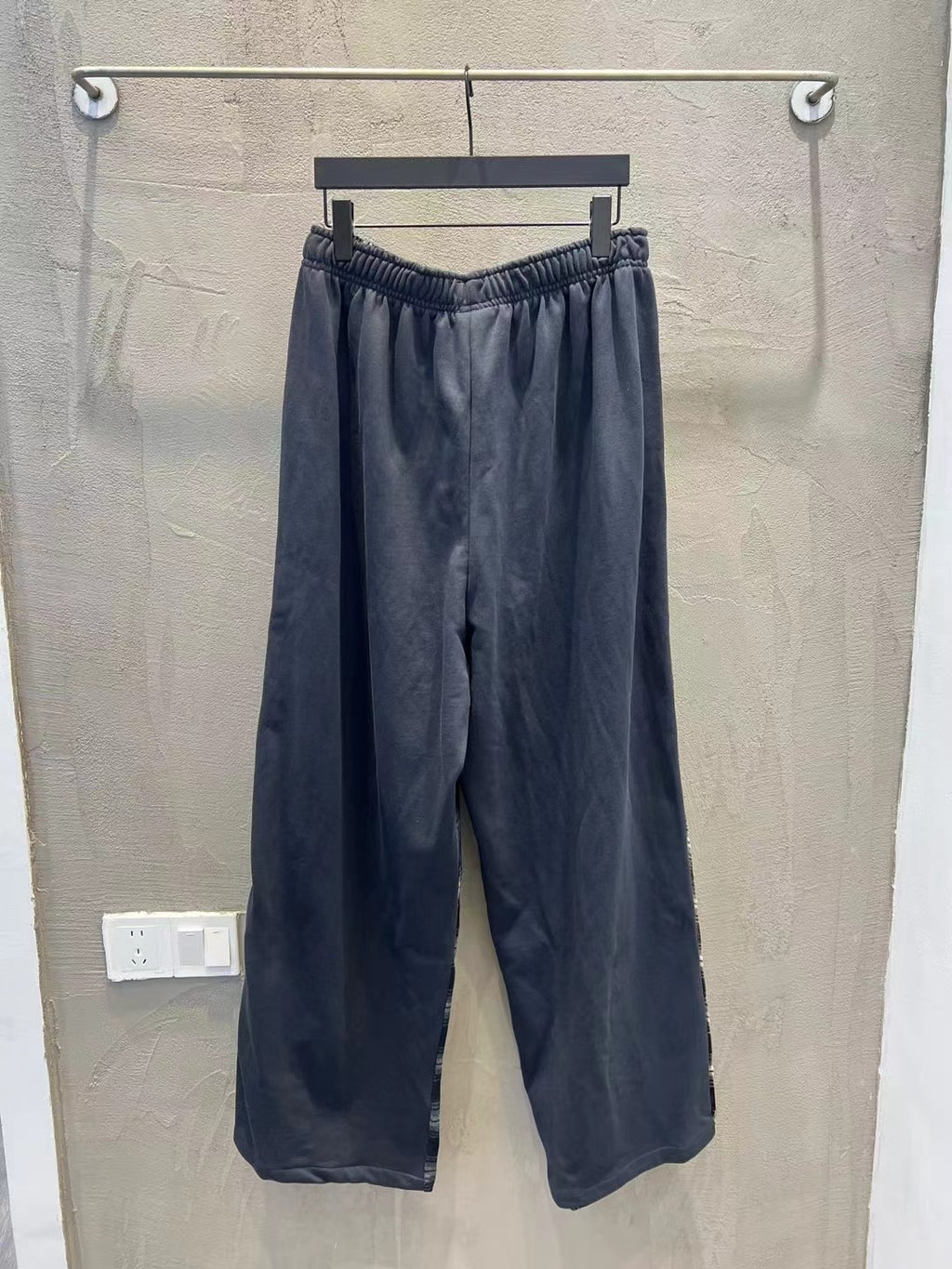 Solid navy wide-leg pants with elastic waist and relaxed, straight legs