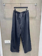 Solid navy wide-leg pants with elastic waist and relaxed, straight legs