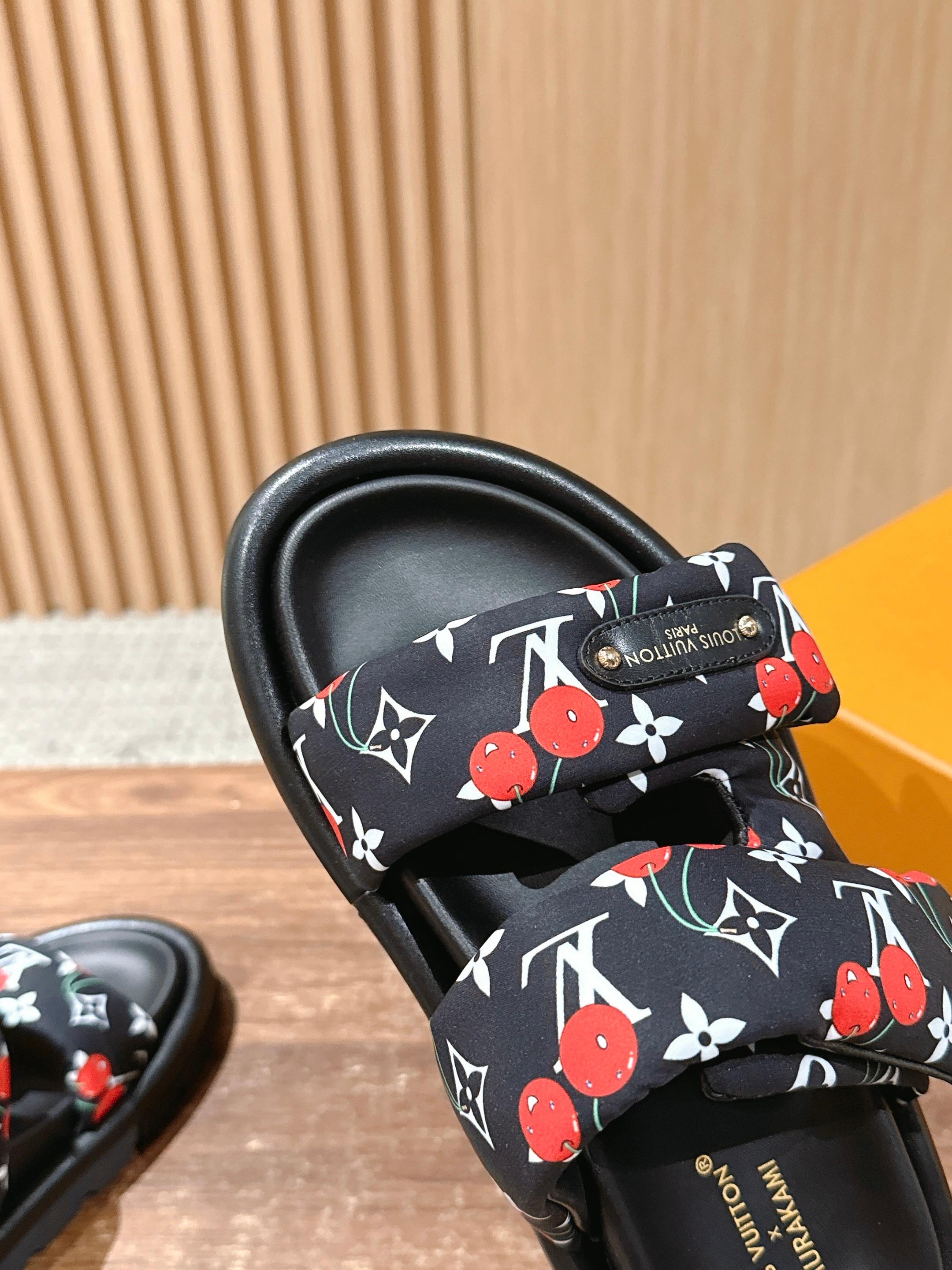 Louis Vuitton slide sandal close-up, black cherry-and-LV patterned strap on black footbed