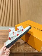 Louis Vuitton slide sandals, white cherry-print straps on a dark rubber sole