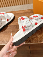 Louis Vuitton slide sandals, white cherry-print straps with textured black sole base