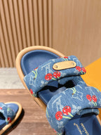 Louis Vuitton blue denim sandal close-up, tan leather patch and cherry strap