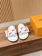 Louis Vuitton white slide sandals with cherry print and tan strap detail