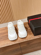 Prada unisex white sneakers, lace-up front and textured rubber sole