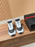 Black and white unisex lace-up sneakers with white rubber sole and mesh panels