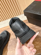 Black lace-up sneaker heel view with cushioned back and textured sole