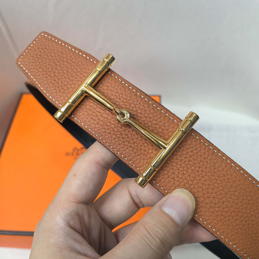 Brown leather belt with gold-tone buckle clasp and stitched leather edge
